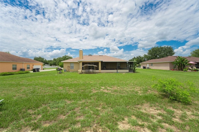 view of yard featuring a sunroom