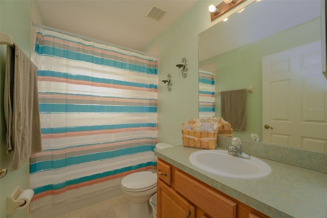 full bathroom featuring tile patterned flooring, shower / bath combination with curtain, vanity, and toilet