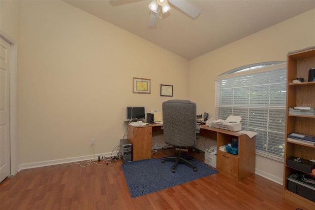 home office featuring ceiling fan, wood-type flooring, and lofted ceiling