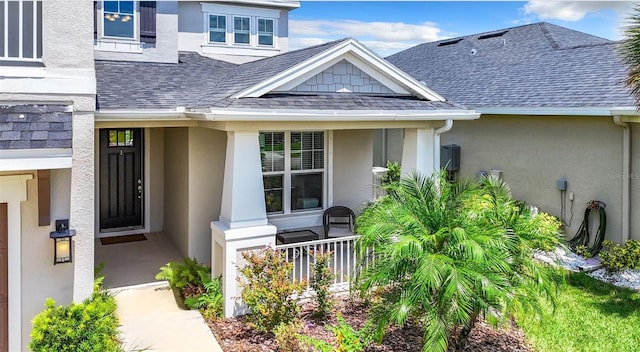 entrance to property featuring a porch