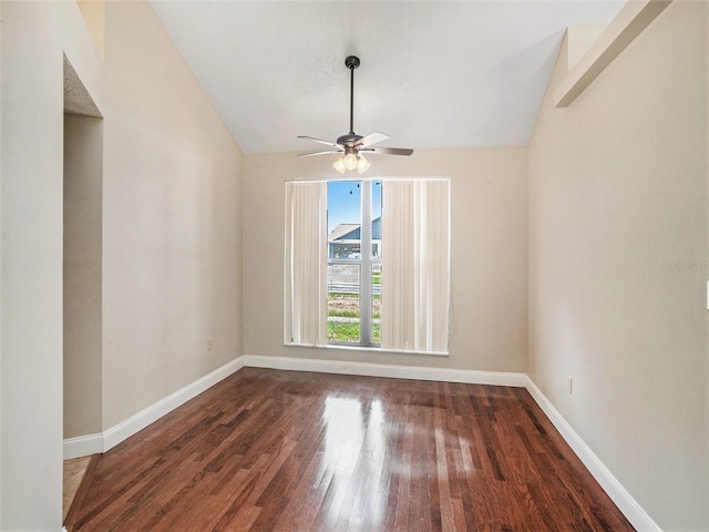 empty room featuring ceiling fan, wood-type flooring, and lofted ceiling