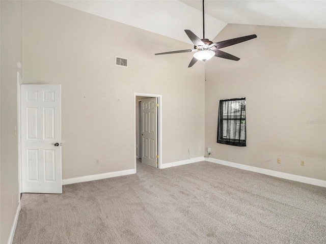 spare room featuring ceiling fan, high vaulted ceiling, and light carpet