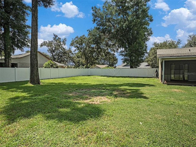 view of yard with a sunroom