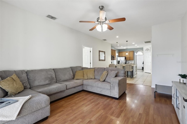 7720 Rathdown Ln, Wesley Chapel, FL 33545 - living room featuring ceiling fan, light wood-style flooring, and recessed lighting
