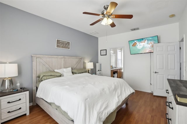 bedroom with ceiling fan and dark wood-type flooring