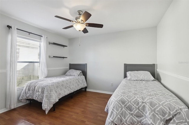 7720 Rathdown Ln, Wesley Chapel, FL 33545 - bedroom featuring wood finished floors and ceiling fan