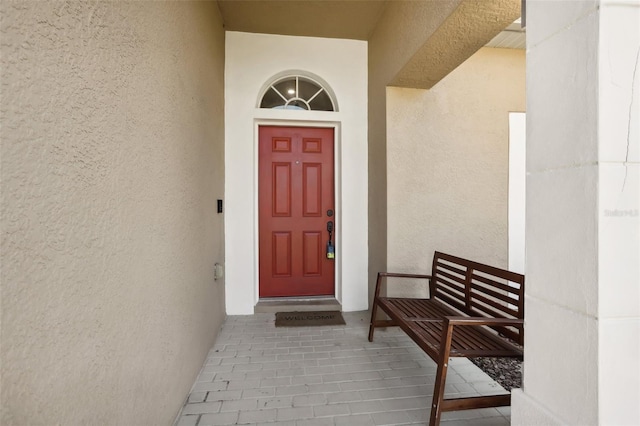 7720 Rathdown Ln, Wesley Chapel, FL 33545 - entrance to property featuring stucco siding