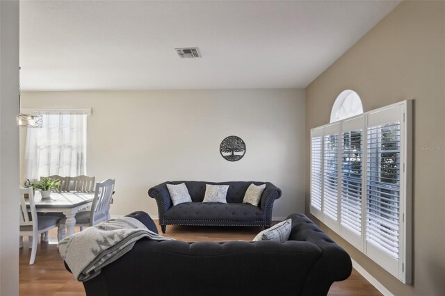 7720 Rathdown Ln, Wesley Chapel, FL 33545 - living area with wood finished floors
