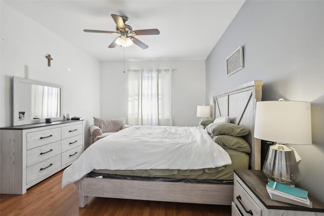 bedroom with hardwood / wood-style floors and ceiling fan