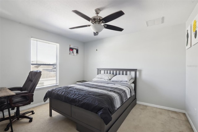 bedroom with light carpet and ceiling fan