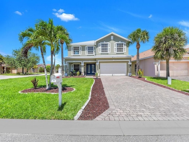 view of front facade featuring a garage and a front lawn