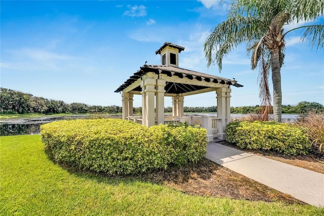 view of home's community featuring a yard and a water view