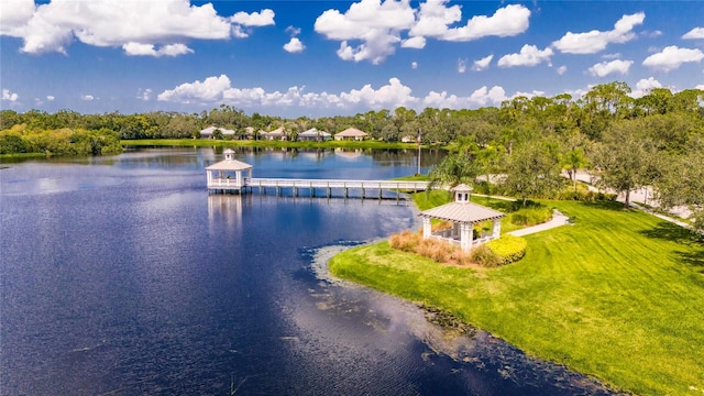 property view of water featuring a boat dock and a gazebo