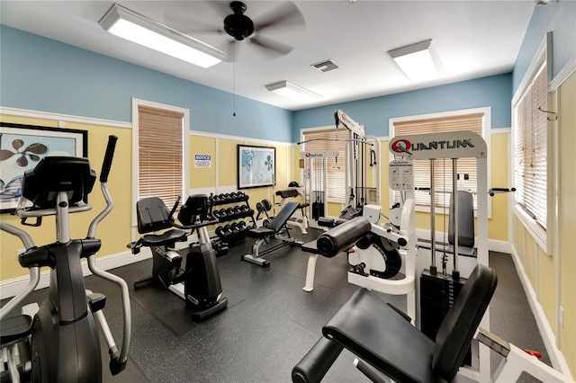 exercise room with ceiling fan