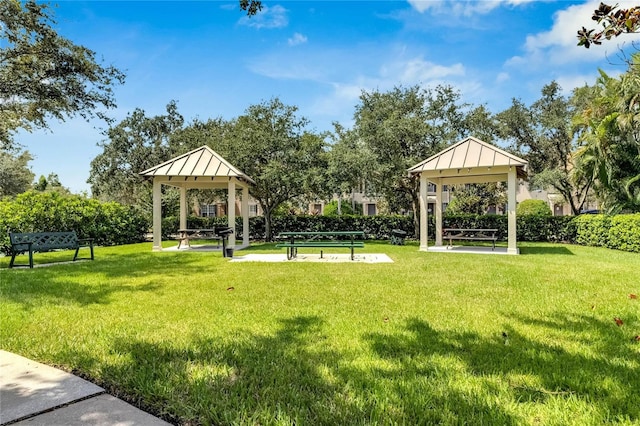 view of community with a lawn and a gazebo