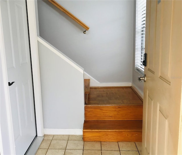 staircase with tile patterned floors