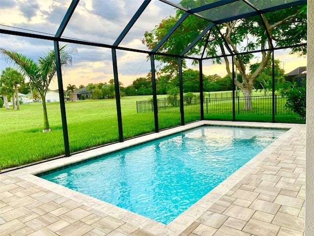 view of pool featuring a patio area, a lanai, and a yard