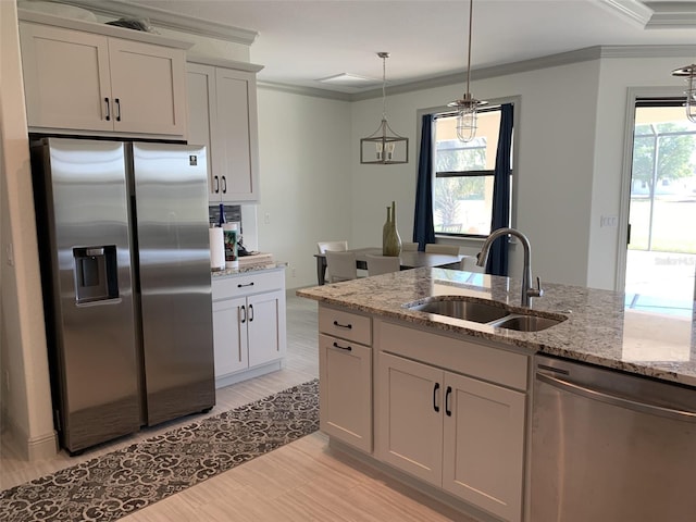 kitchen featuring white cabinetry, light stone countertops, sink, and appliances with stainless steel finishes