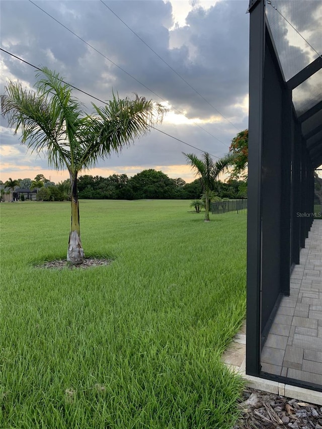 view of yard at dusk