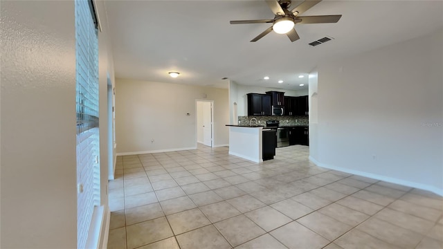 unfurnished living room with ceiling fan and light tile patterned floors