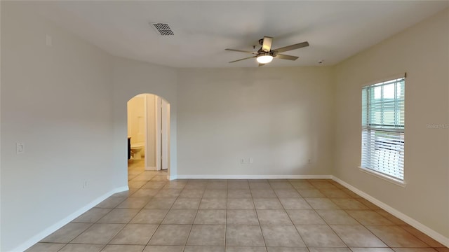 unfurnished room featuring ceiling fan and light tile patterned flooring