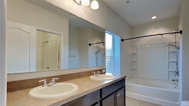 bathroom featuring tile patterned floors, vanity, and tub / shower combination