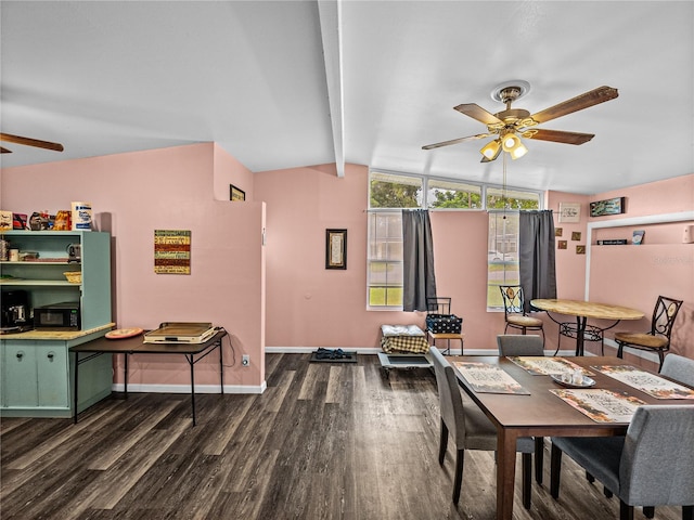 dining area featuring ceiling fan, dark hardwood / wood-style flooring, and lofted ceiling with beams