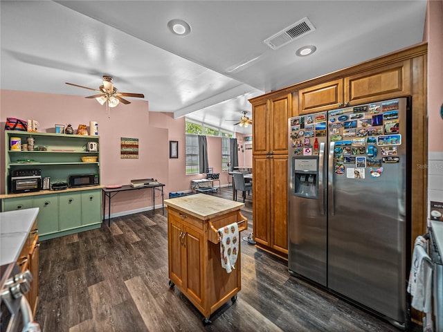 kitchen with ceiling fan, stainless steel fridge with ice dispenser, dark hardwood / wood-style floors, and stove