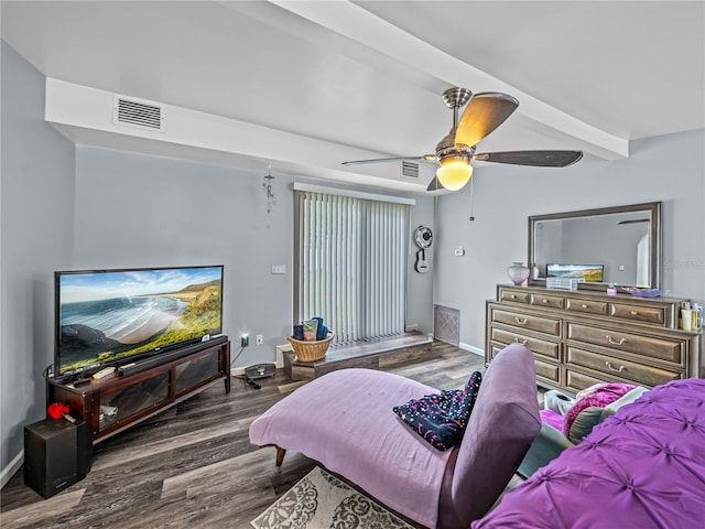 bedroom with ceiling fan, dark wood-type flooring, and beamed ceiling