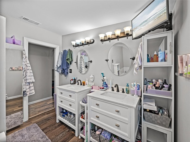 bathroom featuring vanity and hardwood / wood-style floors