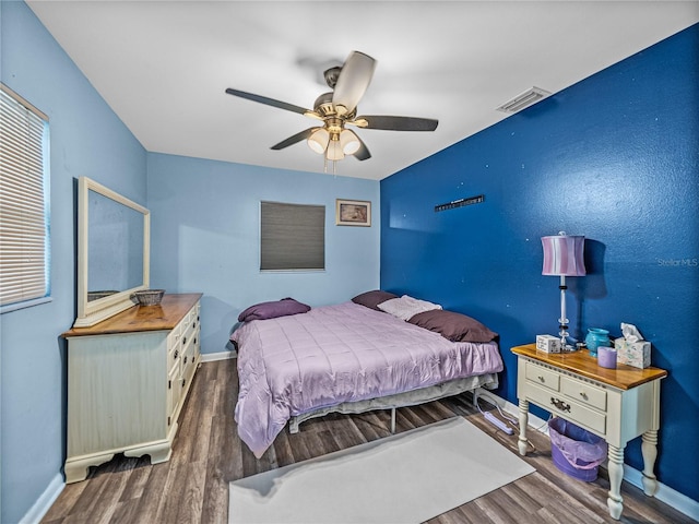 bedroom featuring ceiling fan and hardwood / wood-style flooring