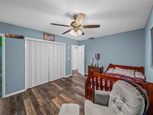 bedroom featuring ceiling fan, hardwood / wood-style flooring, and a closet