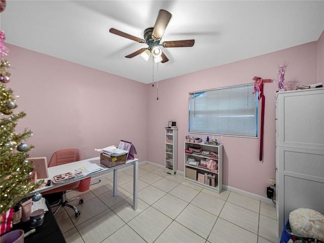 tiled home office featuring ceiling fan