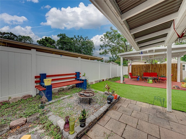 view of yard with an outdoor fire pit and a patio area