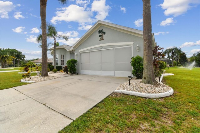 view of front facade with a garage and a front yard