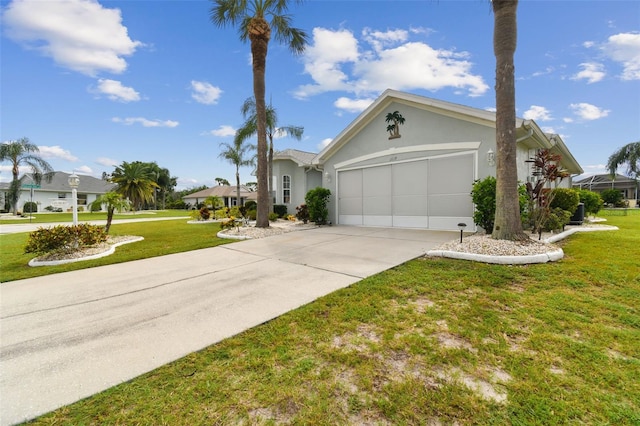 single story home with stucco siding, an attached garage, driveway, and a front lawn