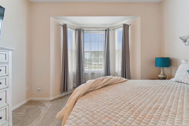 bedroom featuring light colored carpet