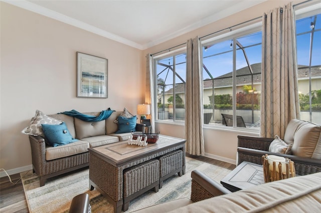 living room featuring hardwood / wood-style floors and ornamental molding