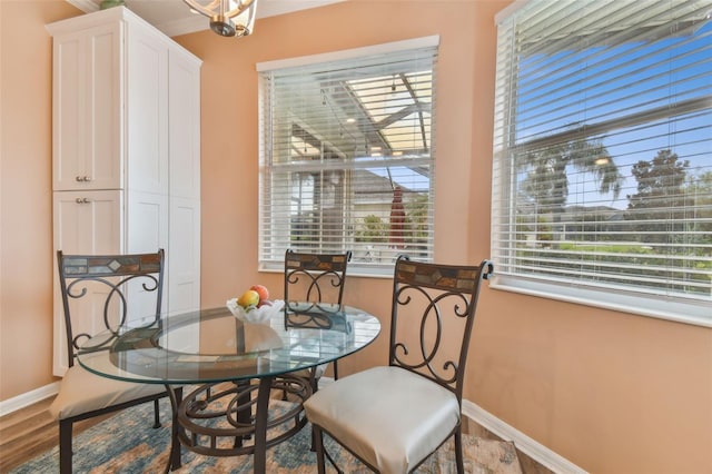 dining room featuring baseboards and wood finished floors