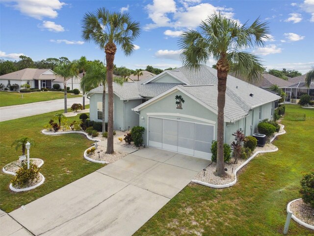 view of front of house featuring a garage and a front yard