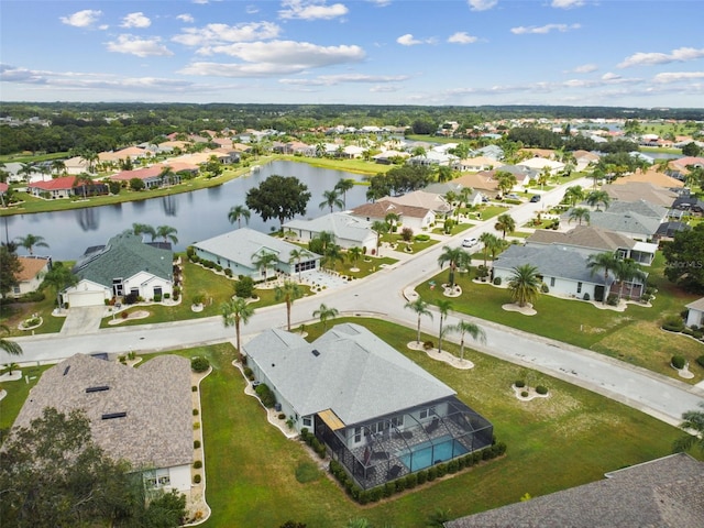 bird's eye view with a residential view and a water view