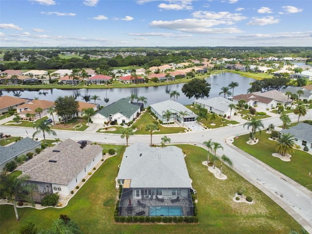 birds eye view of property featuring a residential view and a water view