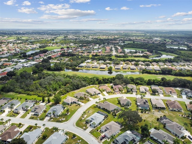 birds eye view of property featuring a residential view and a water view