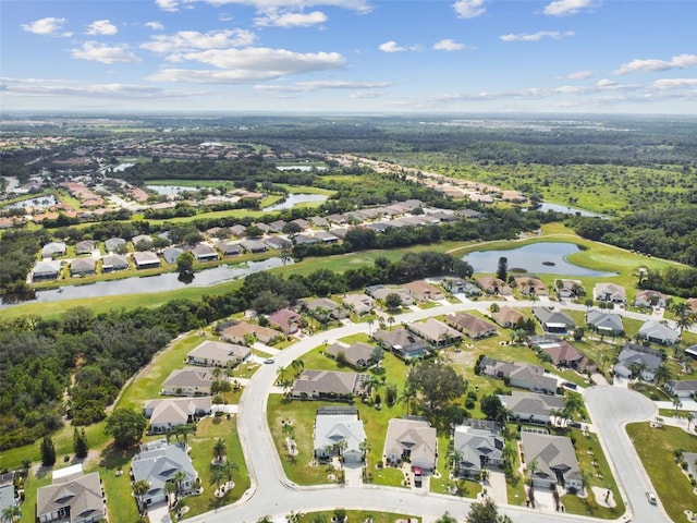 birds eye view of property featuring a residential view and a water view