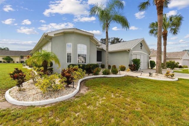 ranch-style home with a front lawn and a garage