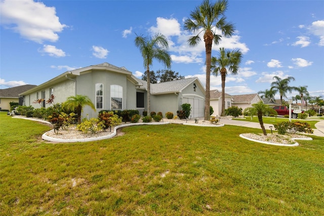 view of front of home featuring concrete driveway, an attached garage, a front yard, and stucco siding