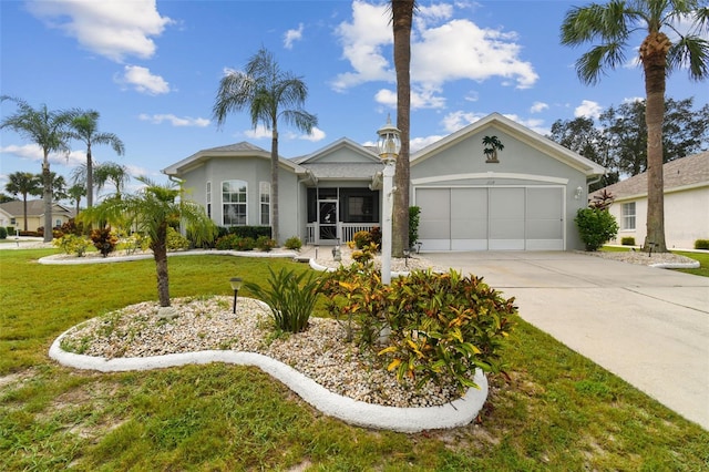 view of front of house featuring concrete driveway, an attached garage, a front lawn, and stucco siding