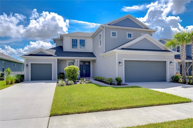 traditional-style house with driveway, a front yard, and stucco siding