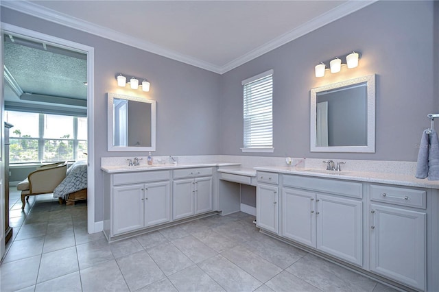 full bathroom featuring ornamental molding, plenty of natural light, and vanity