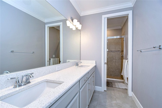 full bathroom featuring crown molding, baseboards, a sink, and a shower stall